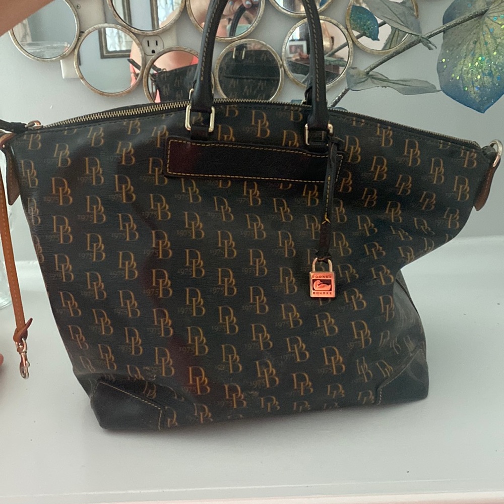 Dooney Bourke purse with several pockets inside